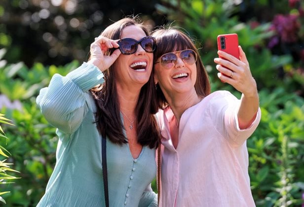 Photo of two women enjoying an RHS garden