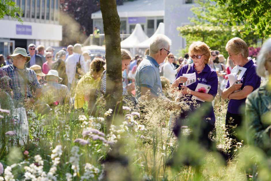 Volunteers helping visitors at a Show