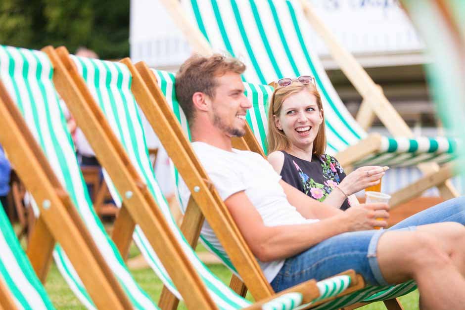 Visitors relax by the Bandstand